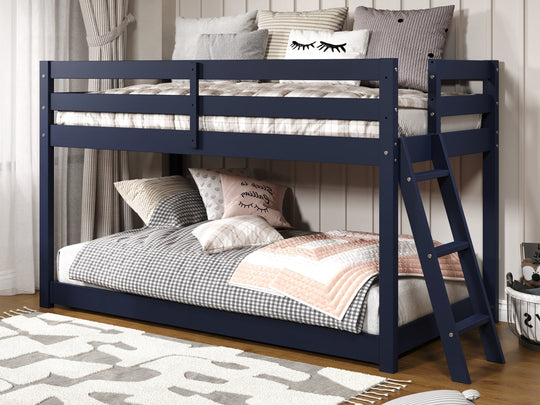 Blue low loft bed with open space beneath the upper twin for play or room use