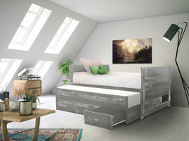 Three drawers are attached to the bed that slide out on metal glides